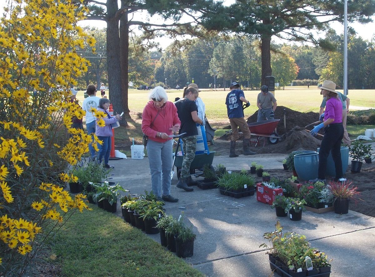 Gardeners planting flowers