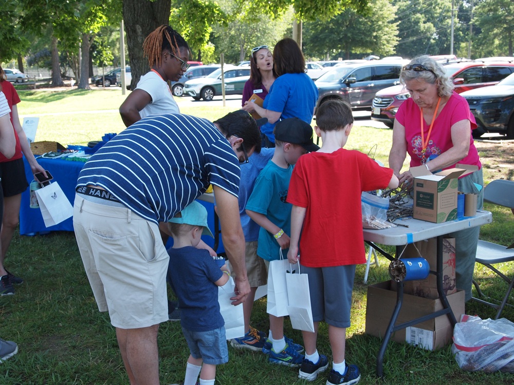 Children at pollinator display table