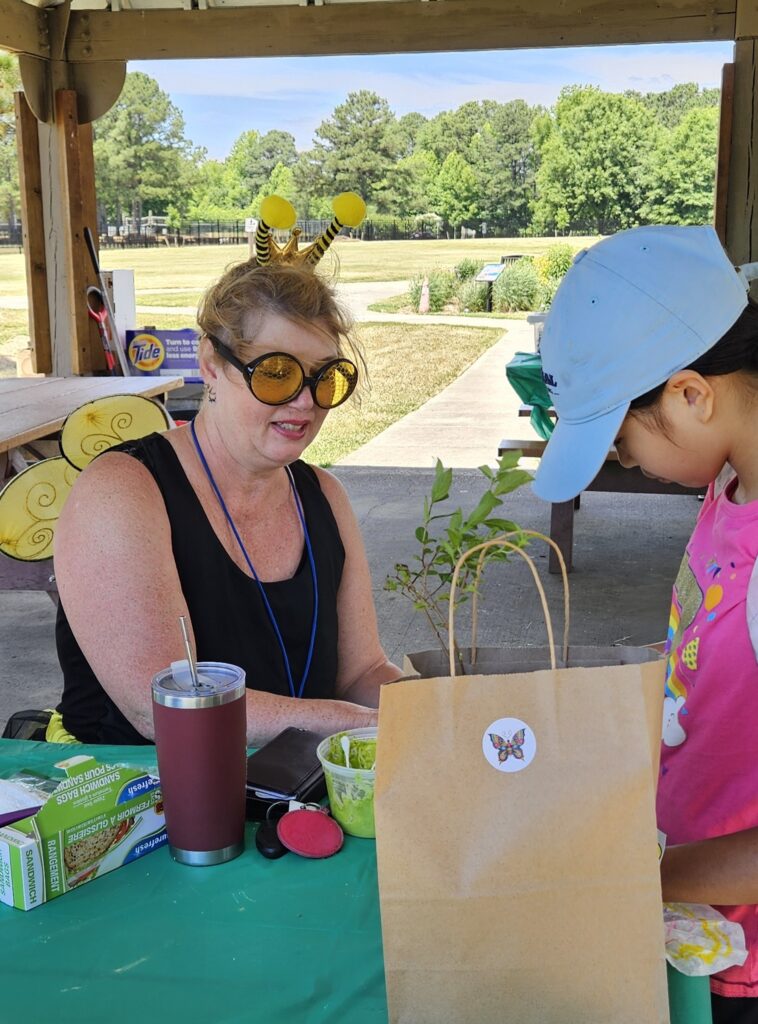 Master Gardener instructing your child on pollinators