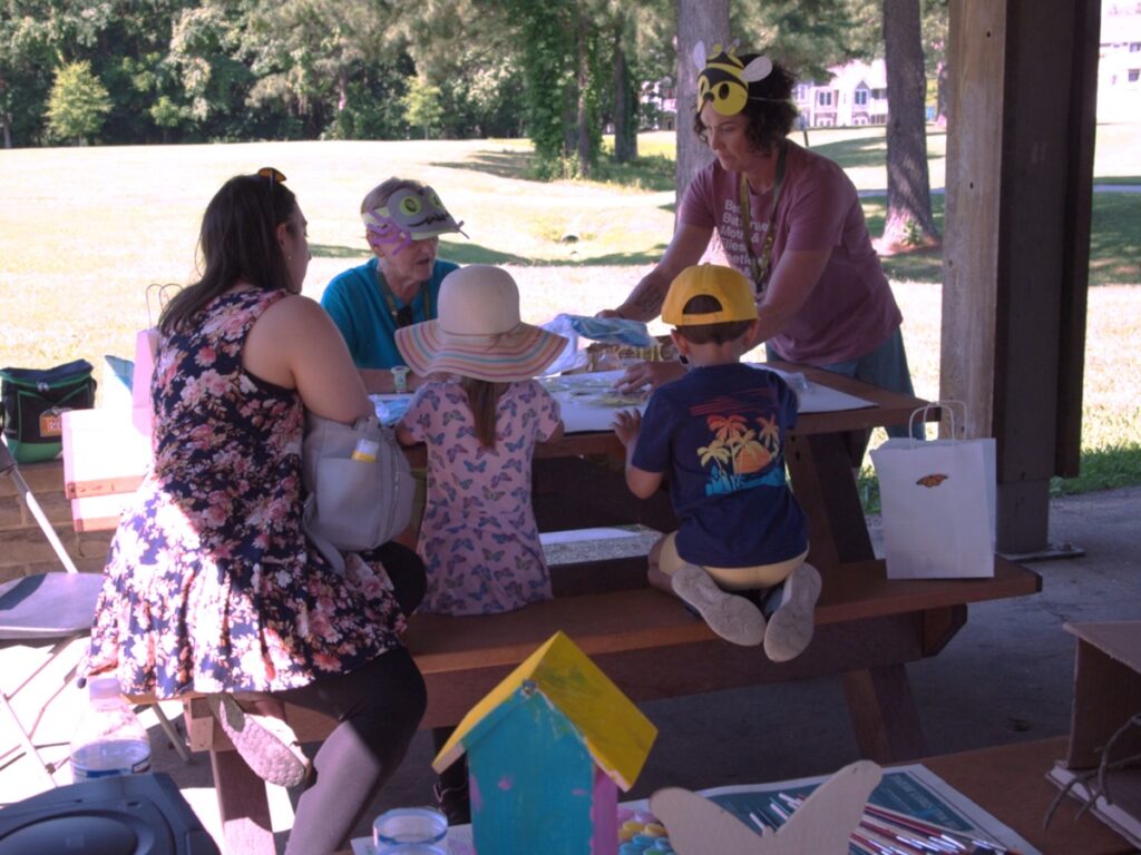 Master Gardeners working with children making crafts
